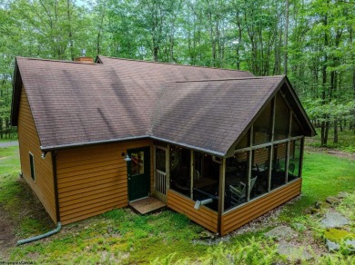 Welcome to 'Evening Shade', a charming, furnished cabin nestled on Alpine Lake Resort in West Virginia - for sale on GolfHomes.com, golf home, golf lot