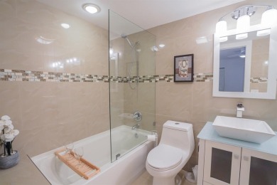 Step into this beautifully renovated, move-in ready first floor on Wynmoor Golf Course in Florida - for sale on GolfHomes.com, golf home, golf lot