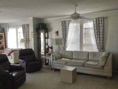 Meticulously maintained home in the much sought after Spanish on Spanish Lakes I in Florida - for sale on GolfHomes.com, golf home, golf lot