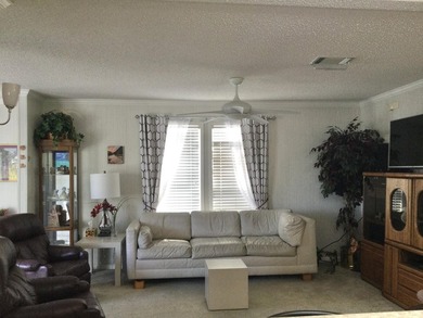 Meticulously maintained home in the much sought after Spanish on Spanish Lakes I in Florida - for sale on GolfHomes.com, golf home, golf lot