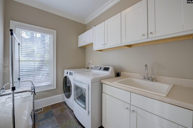 Tucked at the end of a quiet cul-de-sac, this stunning all-brick on The Members Club At Woodcreek in South Carolina - for sale on GolfHomes.com, golf home, golf lot