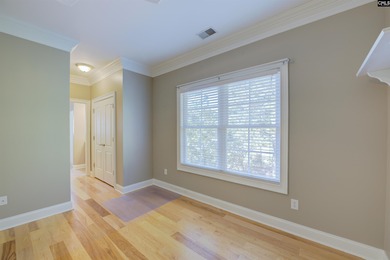 Tucked at the end of a quiet cul-de-sac, this stunning all-brick on The Members Club At Woodcreek in South Carolina - for sale on GolfHomes.com, golf home, golf lot