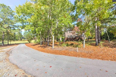 Tucked at the end of a quiet cul-de-sac, this stunning all-brick on The Members Club At Woodcreek in South Carolina - for sale on GolfHomes.com, golf home, golf lot