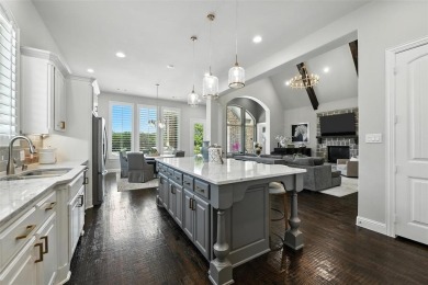 Backed by sweeping golf course views and designed with both on Lantana Golf Club in Texas - for sale on GolfHomes.com, golf home, golf lot