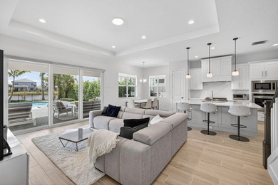 Waterfront living meets effortless luxury in this fully upgraded on Palm Beach Gardens Golf Course in Florida - for sale on GolfHomes.com, golf home, golf lot