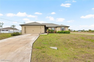 Escape the cold to the perfect SUNNY retreat in Northwest Cape on Burnt Store Golf Club in Florida - for sale on GolfHomes.com, golf home, golf lot