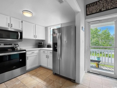 Welcome to this well-maintained 2-bedroom, 2-bath end unit on Heron Point Golf Club in South Carolina - for sale on GolfHomes.com, golf home, golf lot