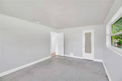 Charming 2-bed, 1-bath home on nearly half an acre (.45+/-) in on Sandridge Golf Course and Club in Florida - for sale on GolfHomes.com, golf home, golf lot