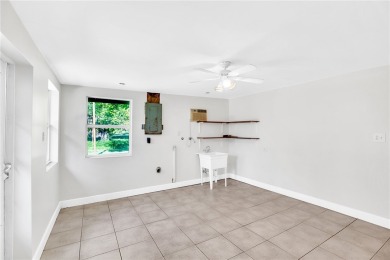 Charming 2-bed, 1-bath home on nearly half an acre (.45+/-) in on Sandridge Golf Course and Club in Florida - for sale on GolfHomes.com, golf home, golf lot