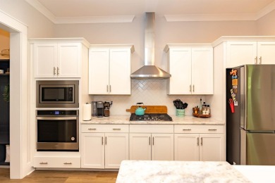 Welcome to 402 Bumble Circle, a beautifully designed 4-bedroom on International Club of Myrtle Beach in South Carolina - for sale on GolfHomes.com, golf home, golf lot