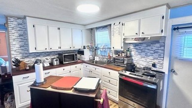 This cozy house is in the very desirable 55+ Old Bridge Village on Riverbend Golf and Country Club in Florida - for sale on GolfHomes.com, golf home, golf lot