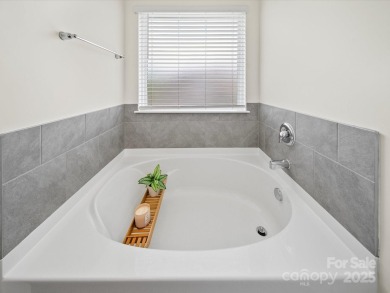 Nestled on a serene cul-de-sac lot with a picturesque pond view on Edgewater Golf Club in South Carolina - for sale on GolfHomes.com, golf home, golf lot