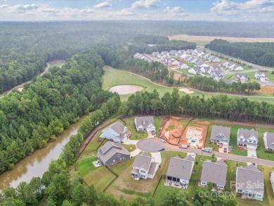 Nestled on a serene cul-de-sac lot with a picturesque pond view on Edgewater Golf Club in South Carolina - for sale on GolfHomes.com, golf home, golf lot