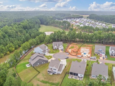 Nestled on a serene cul-de-sac lot with a picturesque pond view on Edgewater Golf Club in South Carolina - for sale on GolfHomes.com, golf home, golf lot