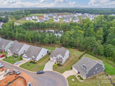 Nestled on a serene cul-de-sac lot with a picturesque pond view on Edgewater Golf Club in South Carolina - for sale on GolfHomes.com, golf home, golf lot