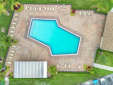 Bright & Clean first-floor 2-bedroom, 1.5-bathroom Waterfront on Flamingo Lakes Country Club in Florida - for sale on GolfHomes.com, golf home, golf lot