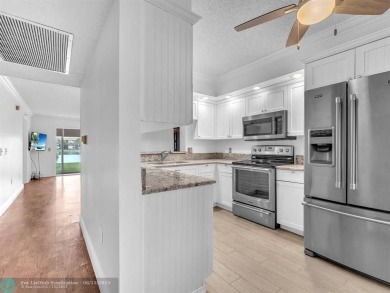 Bright & Clean first-floor 2-bedroom, 1.5-bathroom Waterfront on Flamingo Lakes Country Club in Florida - for sale on GolfHomes.com, golf home, golf lot