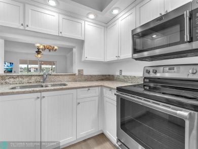 Bright & Clean first-floor 2-bedroom, 1.5-bathroom Waterfront on Flamingo Lakes Country Club in Florida - for sale on GolfHomes.com, golf home, golf lot