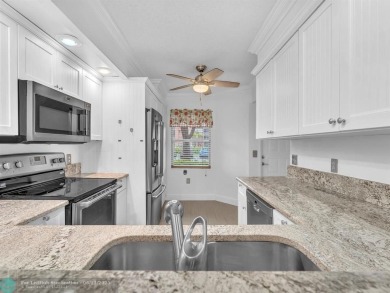 Bright & Clean first-floor 2-bedroom, 1.5-bathroom Waterfront on Flamingo Lakes Country Club in Florida - for sale on GolfHomes.com, golf home, golf lot