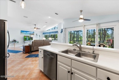 This golf community Florida Home is located on the 11th fairway on The Grand Club - Pine Lakes Course in Florida - for sale on GolfHomes.com, golf home, golf lot
