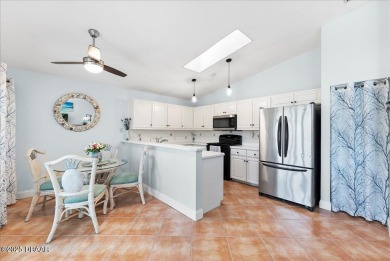 This golf community Florida Home is located on the 11th fairway on The Grand Club - Pine Lakes Course in Florida - for sale on GolfHomes.com, golf home, golf lot