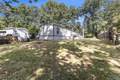 Nestled in a serene lakeside setting, this charming 3-bedroom on Turtle Creek Golf Club in Michigan - for sale on GolfHomes.com, golf home, golf lot