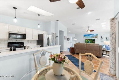 This golf community Florida Home is located on the 11th fairway on The Grand Club - Pine Lakes Course in Florida - for sale on GolfHomes.com, golf home, golf lot