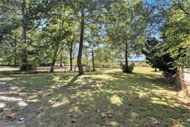 Nestled in a serene lakeside setting, this charming 3-bedroom on Turtle Creek Golf Club in Michigan - for sale on GolfHomes.com, golf home, golf lot