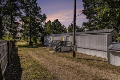 Nestled in a serene lakeside setting, this charming 3-bedroom on Turtle Creek Golf Club in Michigan - for sale on GolfHomes.com, golf home, golf lot