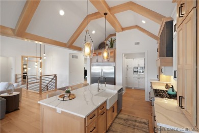 Dive into luxury at this breathtaking new build in Porto Cima on The Club At Porto Cima in Missouri - for sale on GolfHomes.com, golf home, golf lot