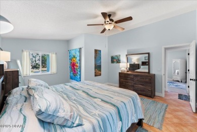 This golf community Florida Home is located on the 11th fairway on The Grand Club - Pine Lakes Course in Florida - for sale on GolfHomes.com, golf home, golf lot