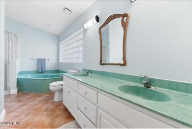 This golf community Florida Home is located on the 11th fairway on The Grand Club - Pine Lakes Course in Florida - for sale on GolfHomes.com, golf home, golf lot