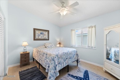 This golf community Florida Home is located on the 11th fairway on The Grand Club - Pine Lakes Course in Florida - for sale on GolfHomes.com, golf home, golf lot