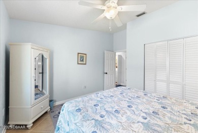 This golf community Florida Home is located on the 11th fairway on The Grand Club - Pine Lakes Course in Florida - for sale on GolfHomes.com, golf home, golf lot