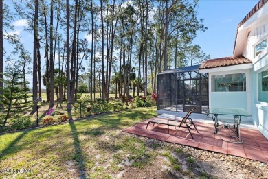 This golf community Florida Home is located on the 11th fairway on The Grand Club - Pine Lakes Course in Florida - for sale on GolfHomes.com, golf home, golf lot