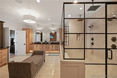 Dive into luxury at this breathtaking new build in Porto Cima on The Club At Porto Cima in Missouri - for sale on GolfHomes.com, golf home, golf lot