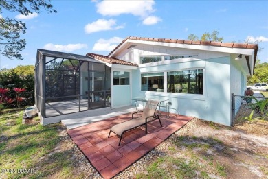 This golf community Florida Home is located on the 11th fairway on The Grand Club - Pine Lakes Course in Florida - for sale on GolfHomes.com, golf home, golf lot