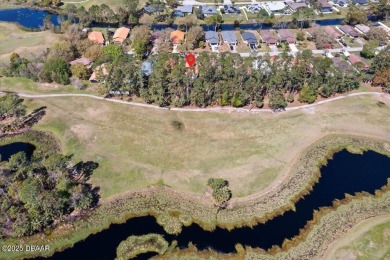 This golf community Florida Home is located on the 11th fairway on The Grand Club - Pine Lakes Course in Florida - for sale on GolfHomes.com, golf home, golf lot