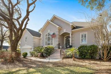 Mature live oaks and lush landscaping frame the elegant front on Kiawah Island Resort - Oak Point in South Carolina - for sale on GolfHomes.com, golf home, golf lot
