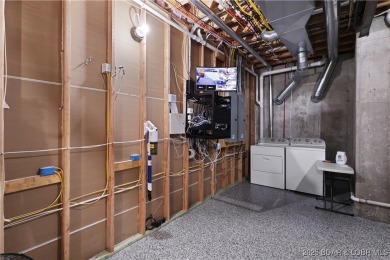 Dive into luxury at this breathtaking new build in Porto Cima on The Club At Porto Cima in Missouri - for sale on GolfHomes.com, golf home, golf lot