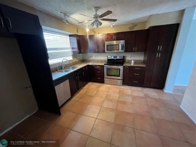 Spacious 3-Bedroom Townhome with Golf Course Views - West on Woodmont Country Club in Florida - for sale on GolfHomes.com, golf home, golf lot