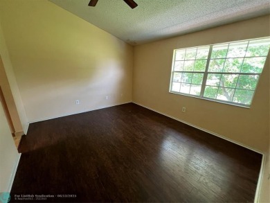 Spacious 3-Bedroom Townhome with Golf Course Views - West on Woodmont Country Club in Florida - for sale on GolfHomes.com, golf home, golf lot
