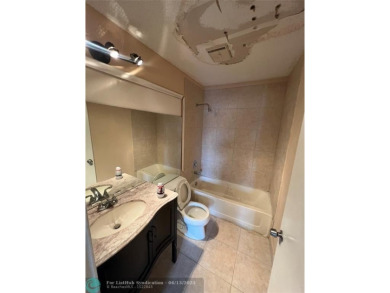 Spacious 3-Bedroom Townhome with Golf Course Views - West on Woodmont Country Club in Florida - for sale on GolfHomes.com, golf home, golf lot