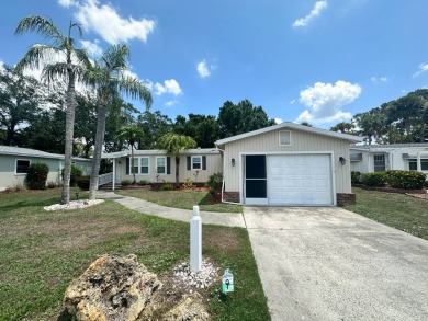 Lot Rent $1037.00 monthly    This beautifully updated home is on Del Tura Golf and Country Club in Florida - for sale on GolfHomes.com, golf home, golf lot