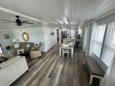 Lot Rent $1037.00 monthly    This beautifully updated home is on Del Tura Golf and Country Club in Florida - for sale on GolfHomes.com, golf home, golf lot