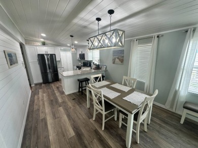 Lot Rent $1037.00 monthly    This beautifully updated home is on Del Tura Golf and Country Club in Florida - for sale on GolfHomes.com, golf home, golf lot