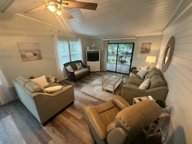 Lot Rent $1037.00 monthly    This beautifully updated home is on Del Tura Golf and Country Club in Florida - for sale on GolfHomes.com, golf home, golf lot