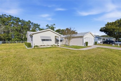 Welcome home to this Holly model 3-bedroom, 2-bath residence in on The Links of Spruce Creek in Florida - for sale on GolfHomes.com, golf home, golf lot
