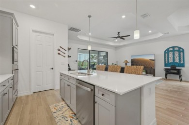 This expansive 2022-built Catalina model in Lakewood National on Lakewood National Golf Club in Florida - for sale on GolfHomes.com, golf home, golf lot