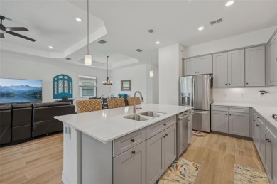 This expansive 2022-built Catalina model in Lakewood National on Lakewood National Golf Club in Florida - for sale on GolfHomes.com, golf home, golf lot